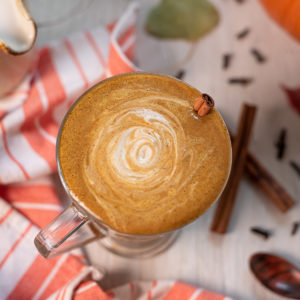 A frothy pumpkin spice latte swirled with cashew cream.