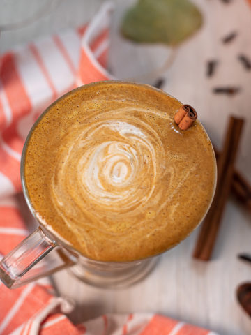 A frothy pumpkin spice latte swirled with cashew cream.