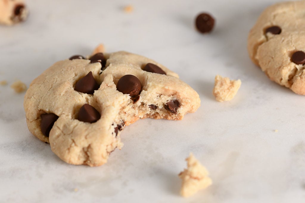 An almond flour cookie with a bite missing.