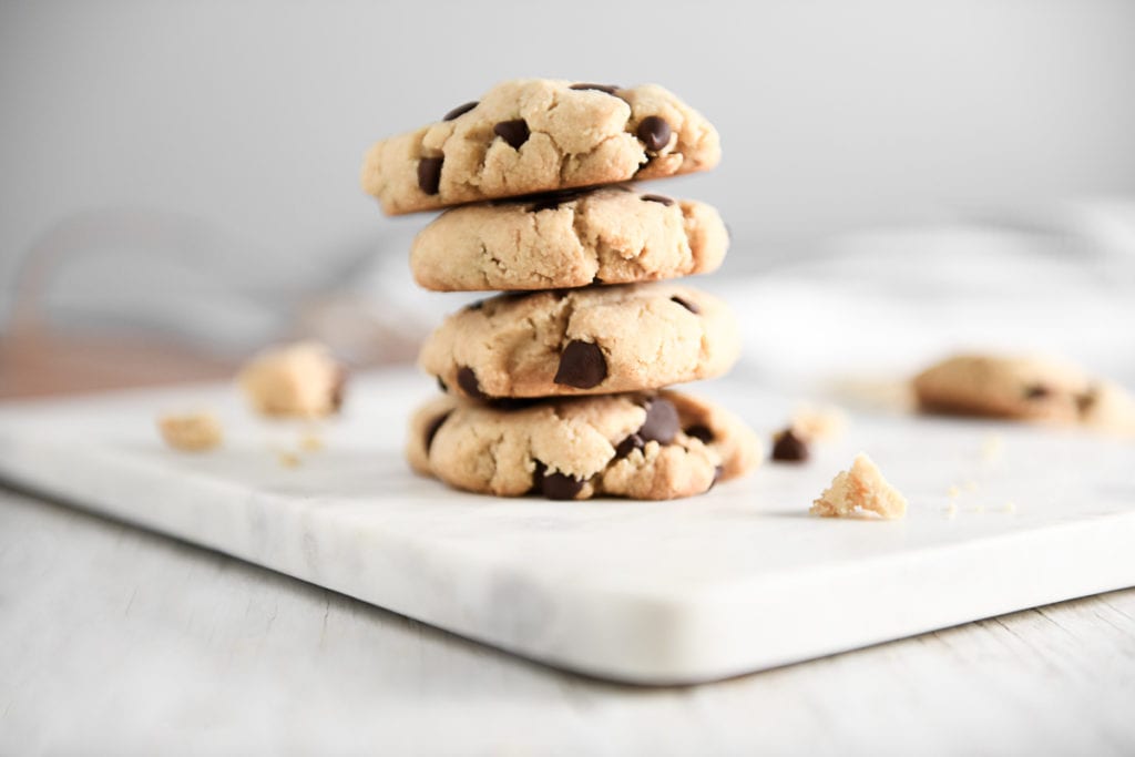 A stack of four Almond Flour Chocolate Chip Cookies.