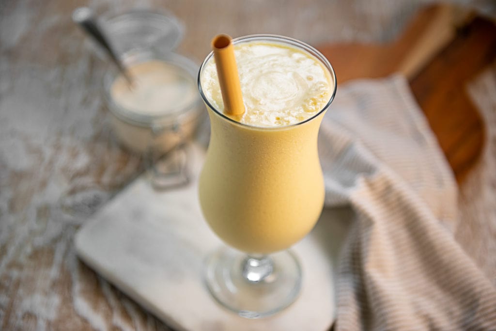 A chilled, soft yellow Pineapple Smoothie in a Poco Grande Glass.