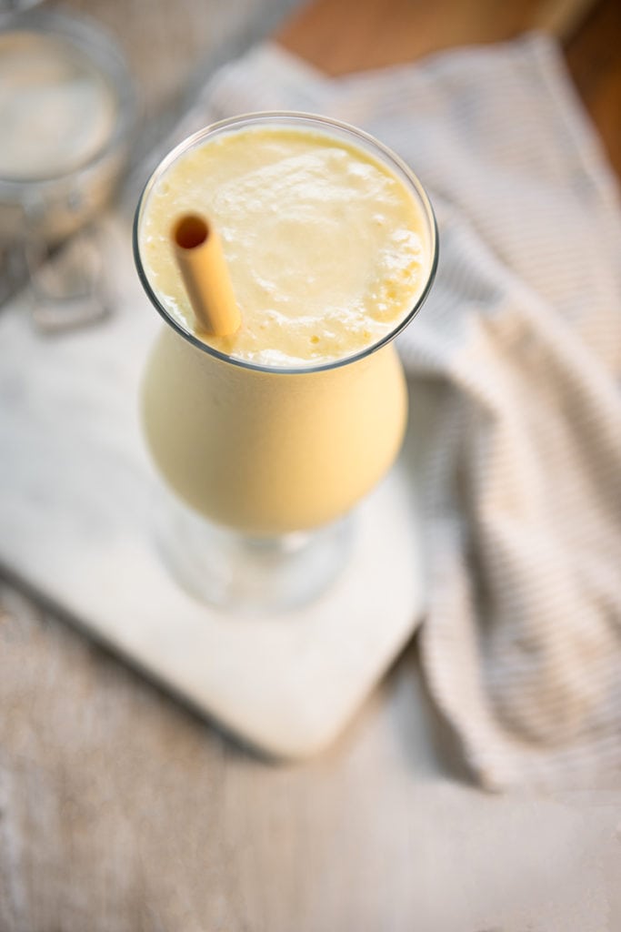 A chilled, soft yellow Pineapple Smoothie in a Poco Grande (AKA Pina Colada) Glass.