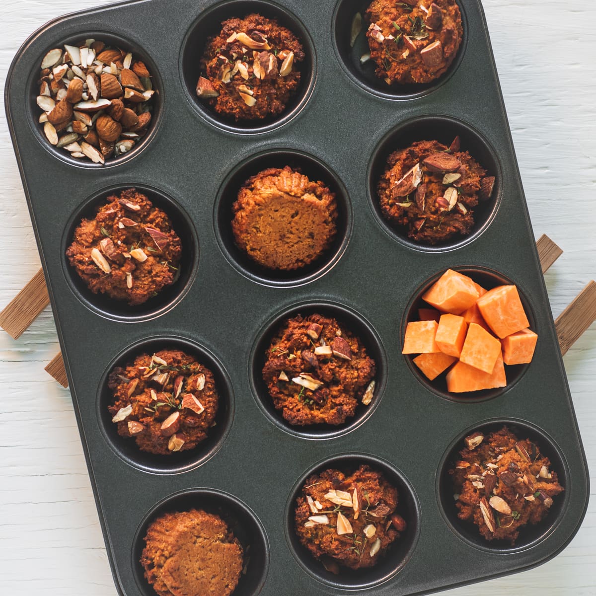 A muffin tin full of sweet potato muffins.