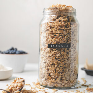 A labelled jar overflowing with granola.