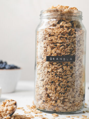 A labelled jar overflowing with granola.