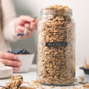 A labelled jar overflowing with granola.