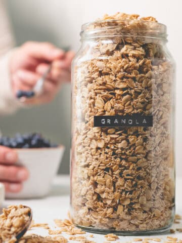 A labelled jar overflowing with granola.