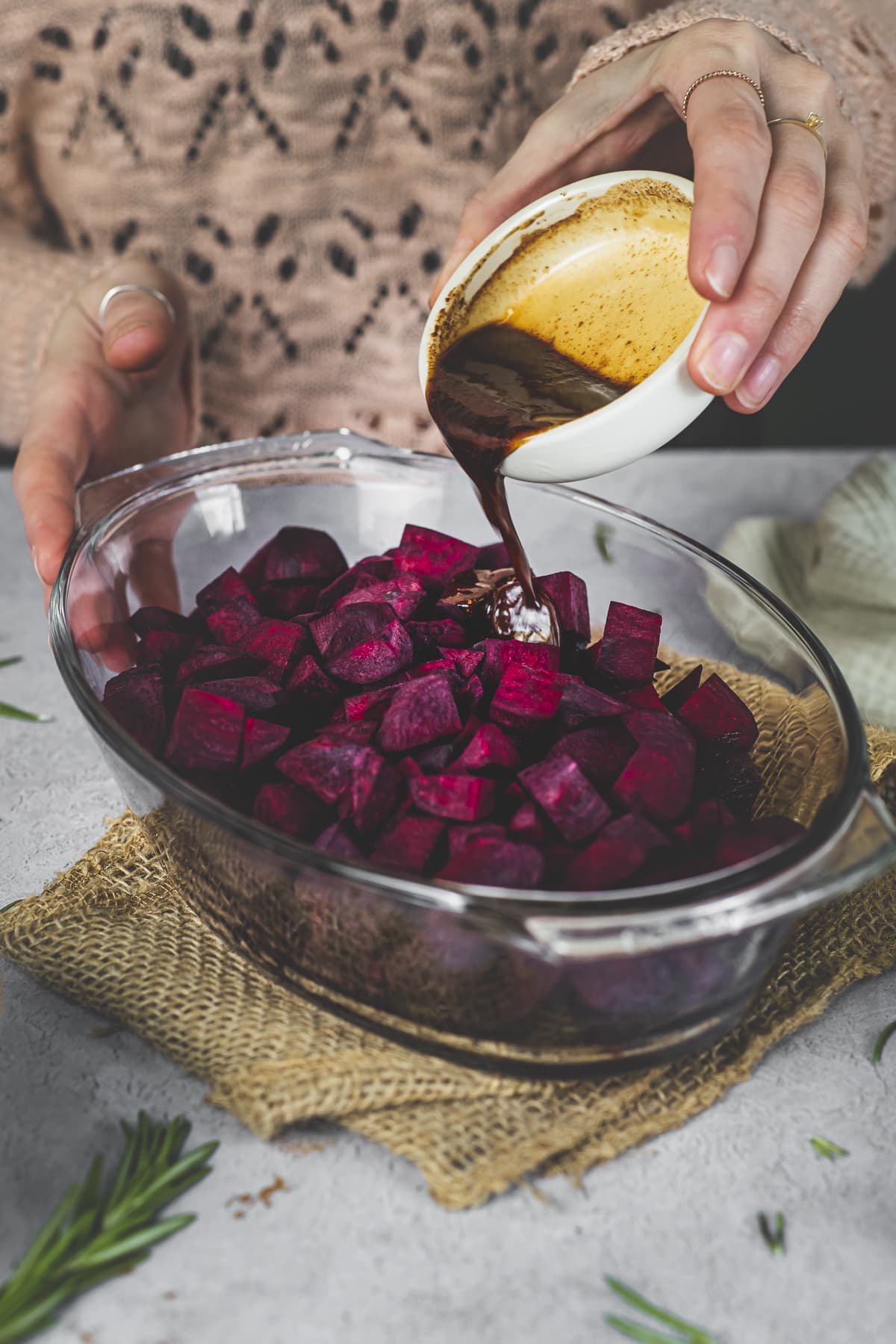 Cinnamon Balsamic Glaze being poured over raw chopped beets.