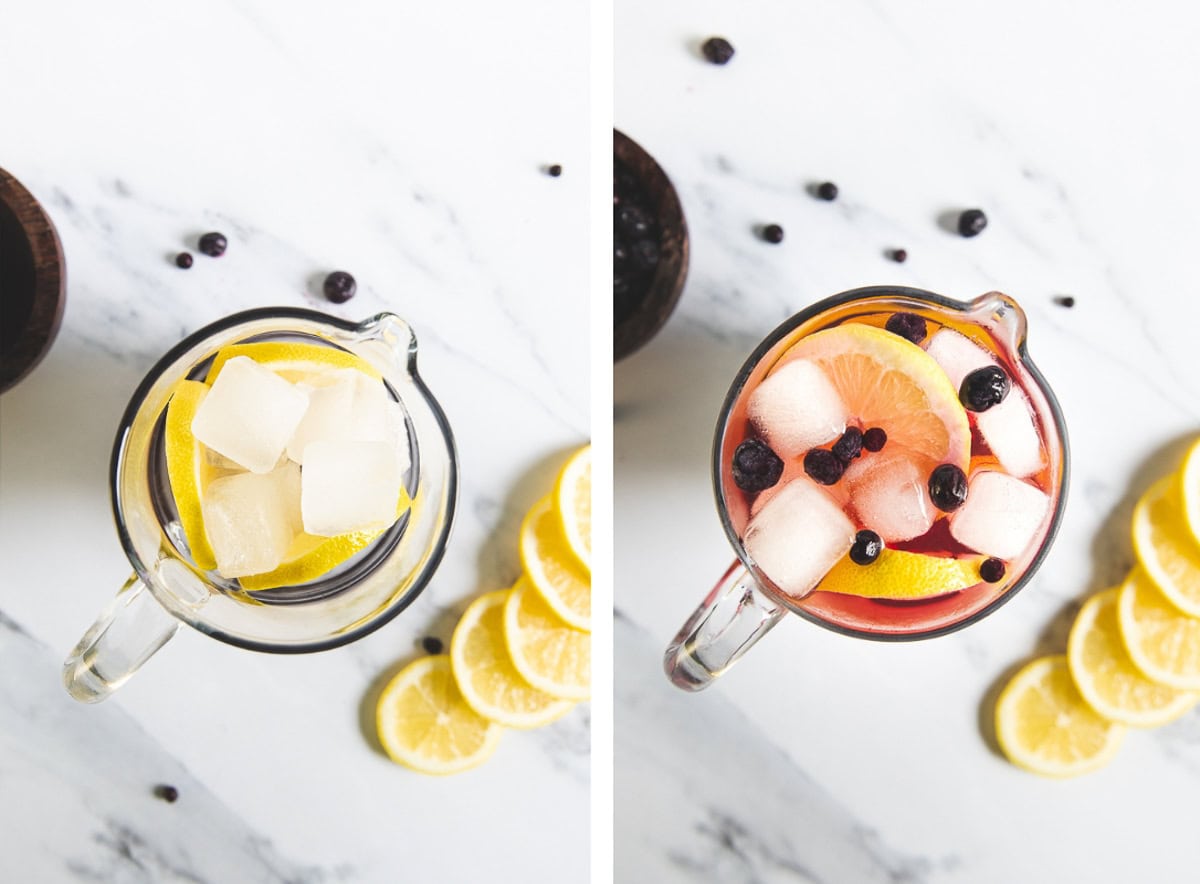 Lemon, ice and blueberries infusing in a pitcher of water.