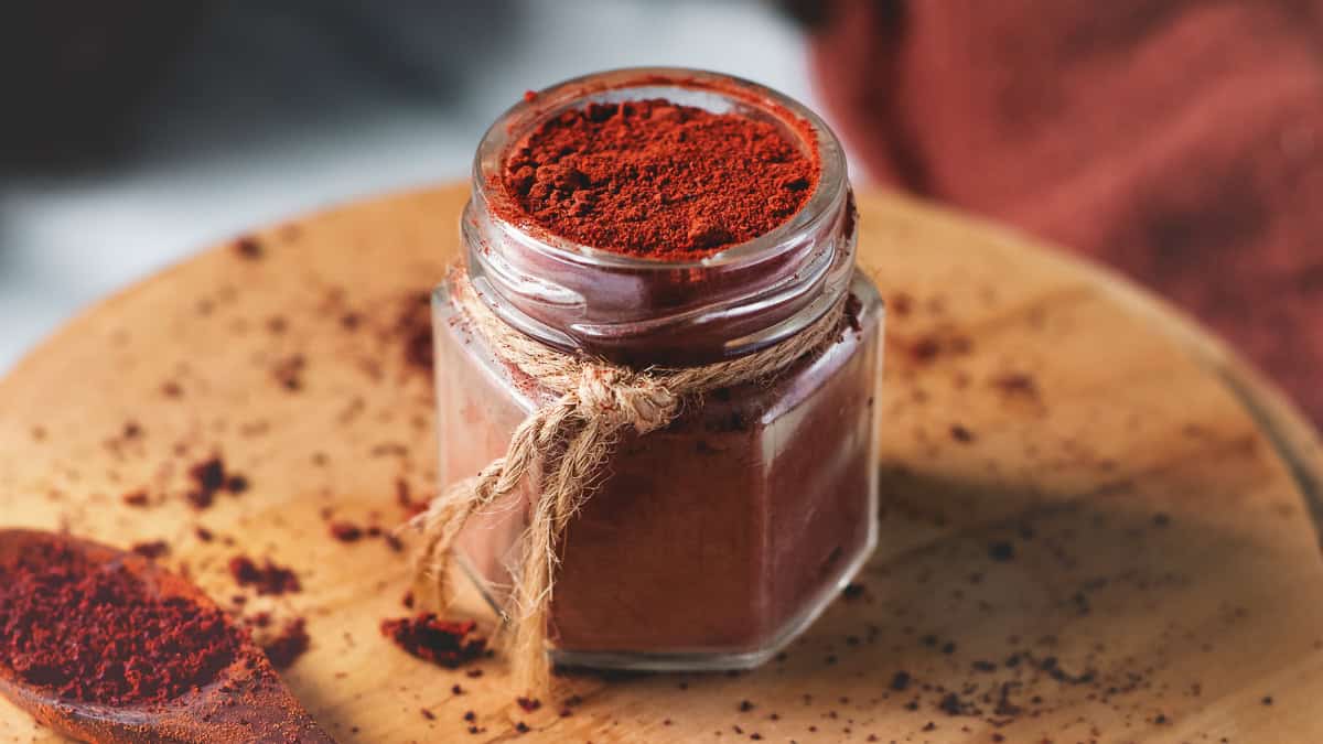 A jar filled with freshly ground beetroot powder.