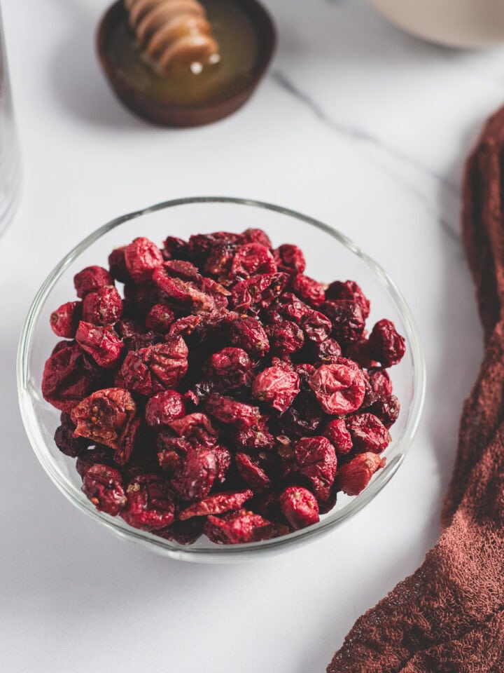 A bowl of oven-dried cranberries.