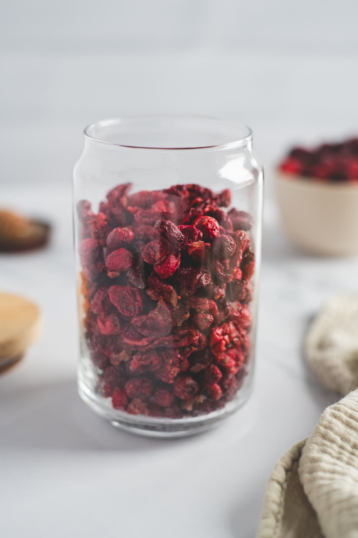 Dried cranberries in a glass jar.