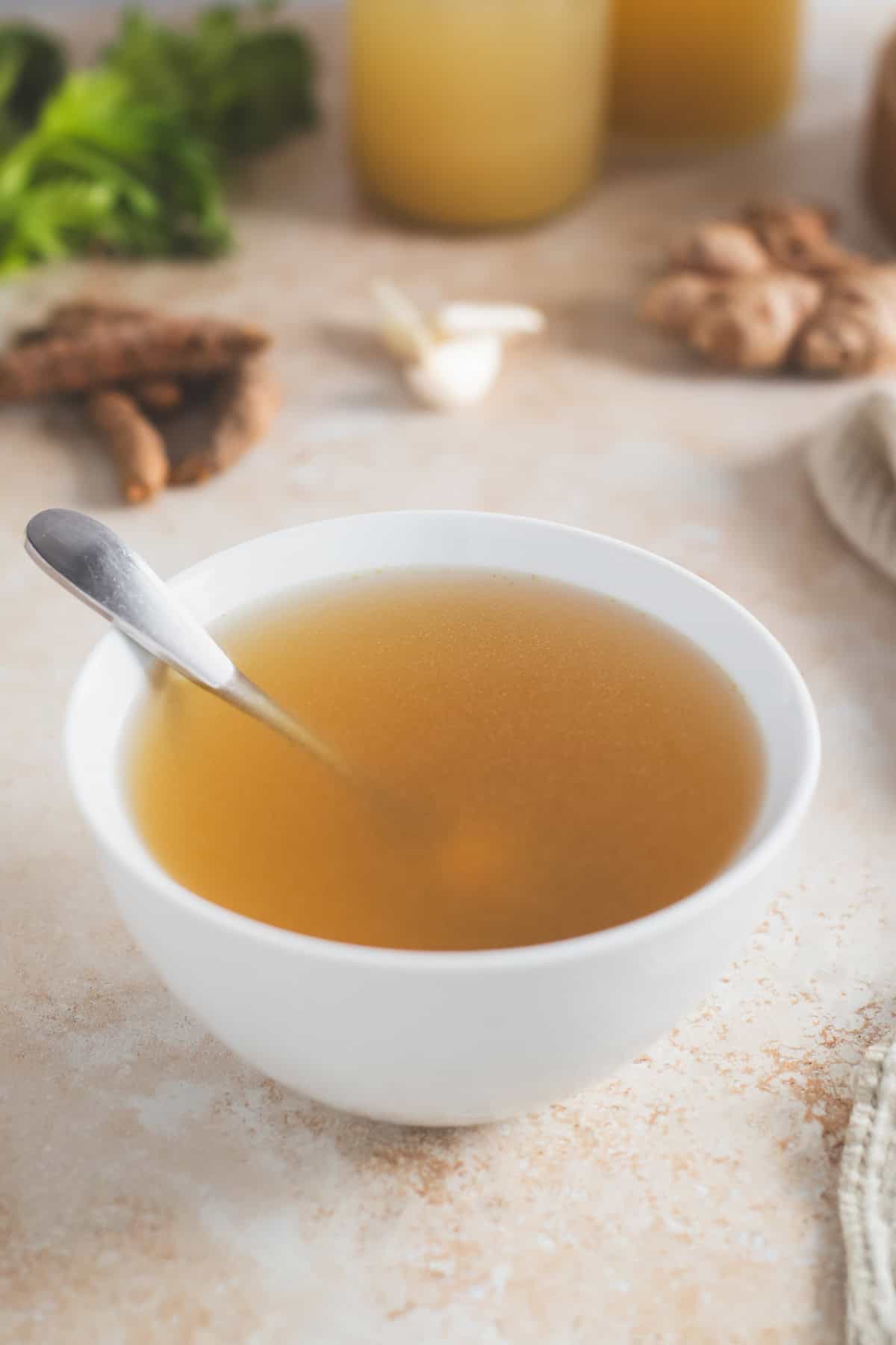 A bowl of translucent golden broth.