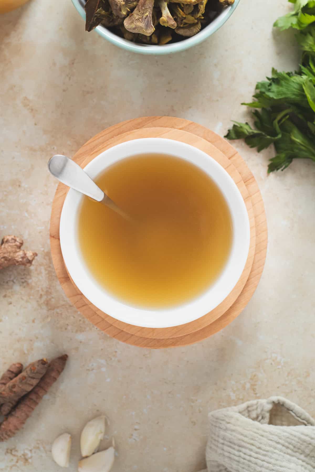 A bowl of golden chicken broth.